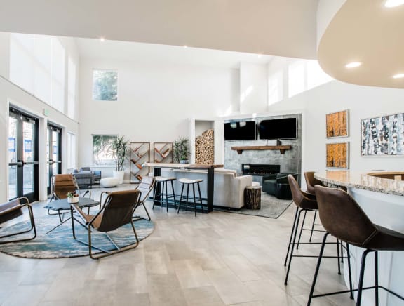 A modern living room with a fireplace and a TV.