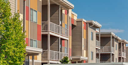an exterior view of an apartment building at Mosaic on the River Apartments, Richland