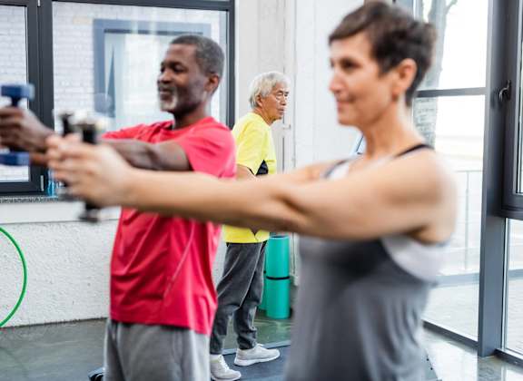 a group of people working out in a gym