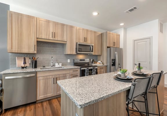 Kitchen with Island at Alta Grand Crossing, Grand Prairie, 75052