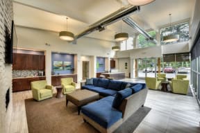 Community Clubhouse Lounge with Lime Sofa Chairs, Blue Sofa Chairs and Rug