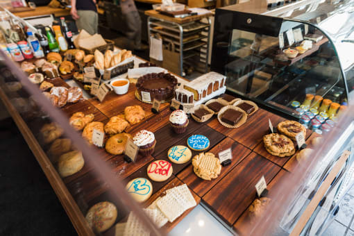 a table full of pastries in a bakery