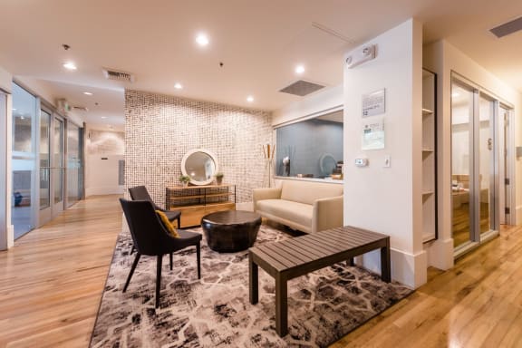 a living room filled with furniture and a large window