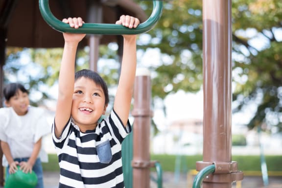 Young Children Having Fun at Playground