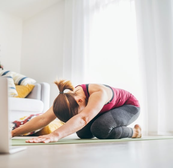 Woman Stretching Doing Yoga at Home