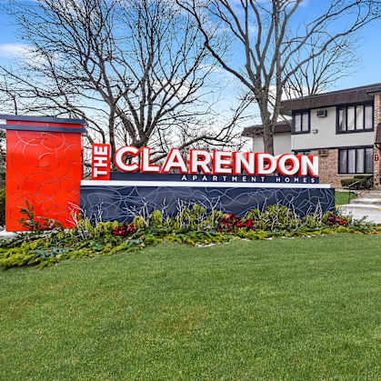 The Clarendon sign is in front of a building.