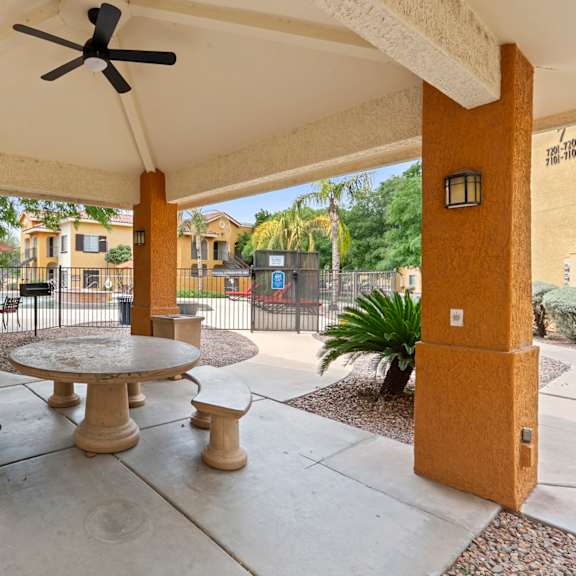 A patio with a table and chairs is shown.