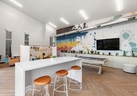 a living room with a white bar and stools  at SECOND AVE COMMONS | BRAND-NEW, Arizona, 85210