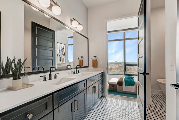 a bathroom with a large window and a large sink