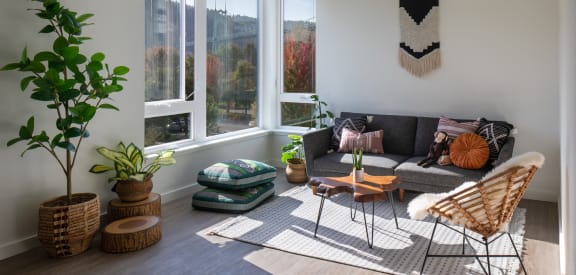 a living room with a couch and a large window