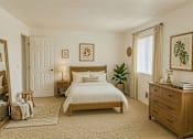 Thumbnail 5 of 8 - A bedroom with a large bed, a nightstand, and a dresser.