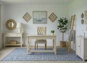 Thumbnail 6 of 8 - A white chair sits in front of a wooden desk with a blue rug underneath.
