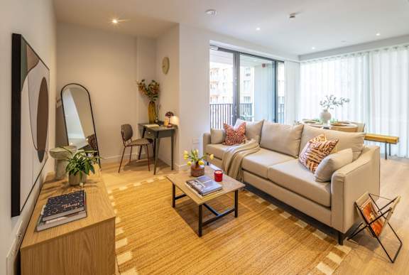 Living room and dining area in 2 bedroom apartment at The Maple