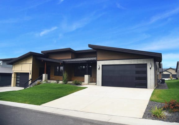 a house with a driveway and a garage door