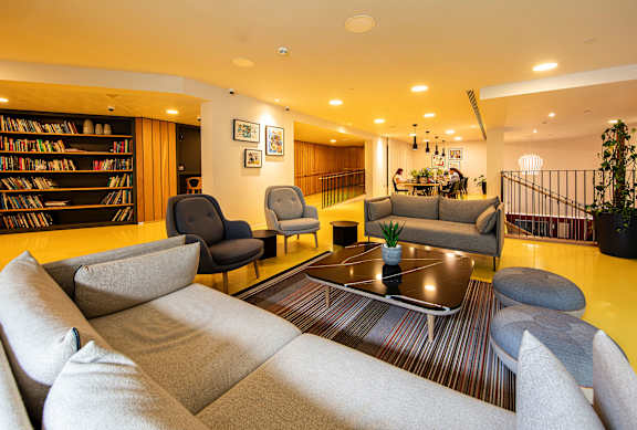 A living room with a grey sofa and a coffee table.