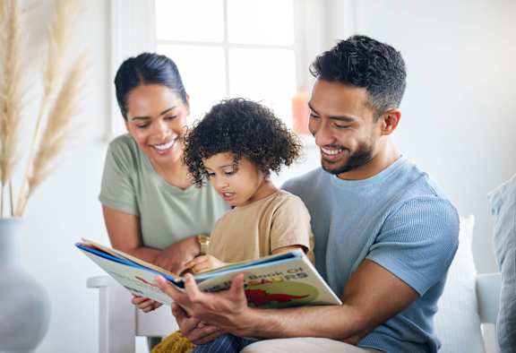 Young Family Reading a Book Together at Loree Grand at Union Place, Washington