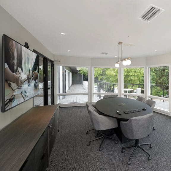 a room filled with furniture and a large window