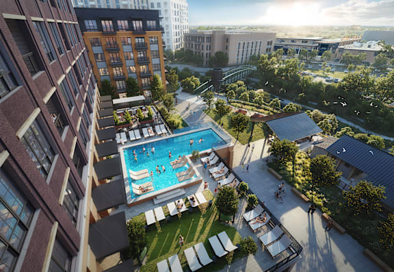 an aerial view of an apartment building with an outdoor swimming pool