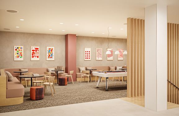 A room with a couch, chairs, and tables with artwork on the wall.