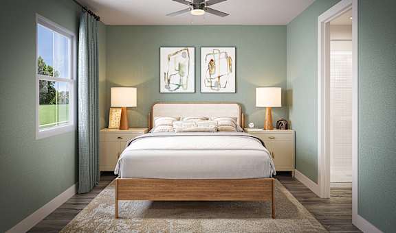 A bedroom with a bed, two lamps, and a ceiling fan.