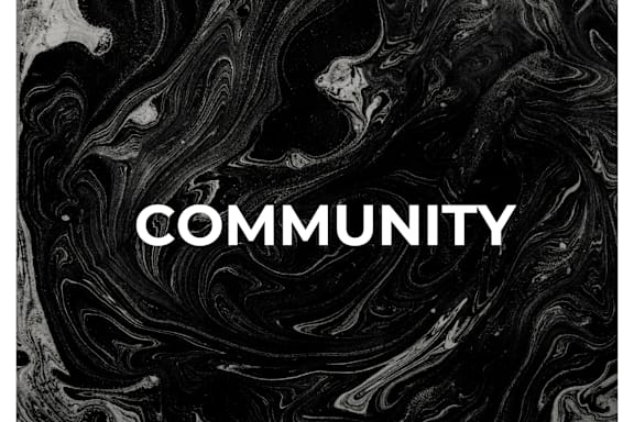 The word "COMMUNITY" is written in white on a black and white marbled background.