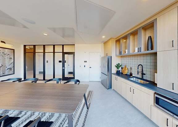 a large kitchen and dining area with a table and chairs