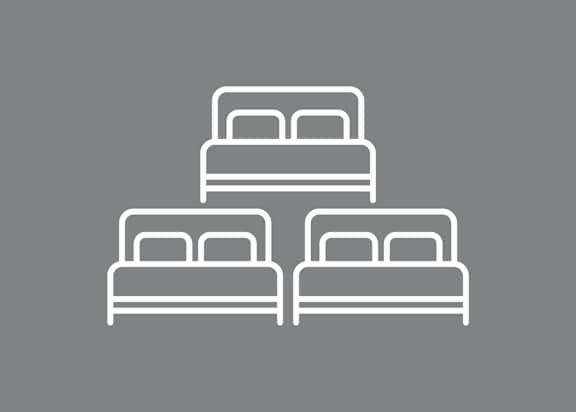 Three beds are stacked on top of each other.