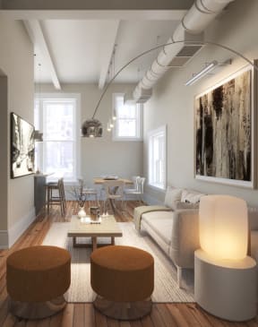a living room with a white couch and a table at East 4th Street, Cleveland, Ohio