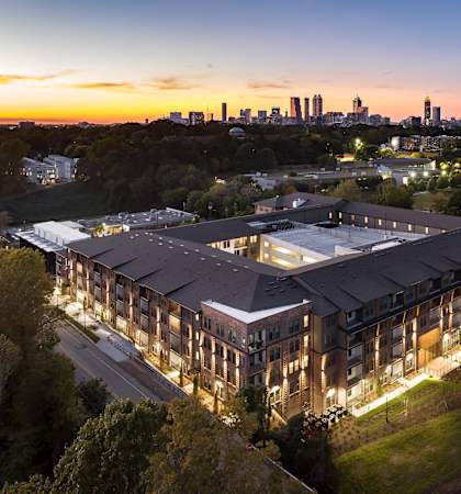 Argos apartments drone aerial view with city skyline in the background
