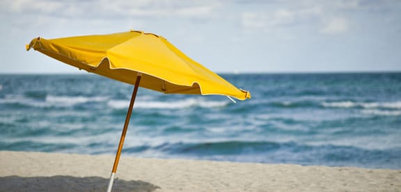 yellow umbrella on the beach