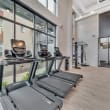 the gym at the district flats apartments in lenexa