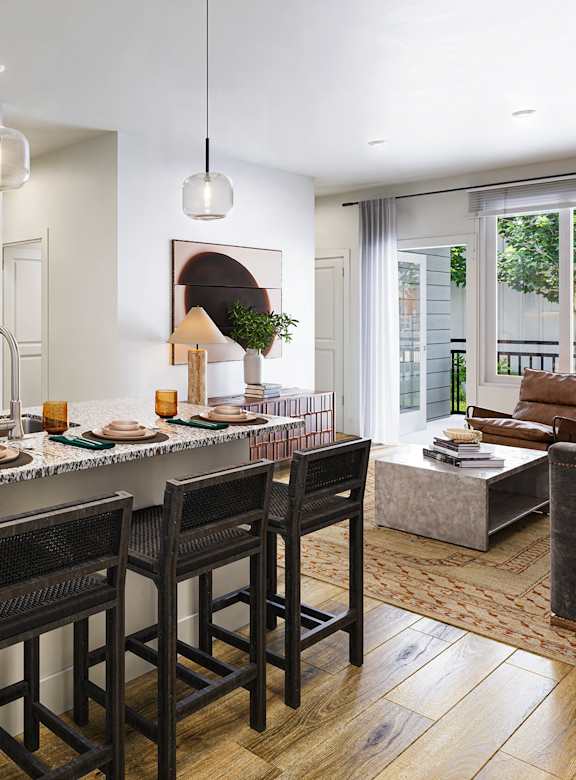A kitchen with a bar area and a dining table.