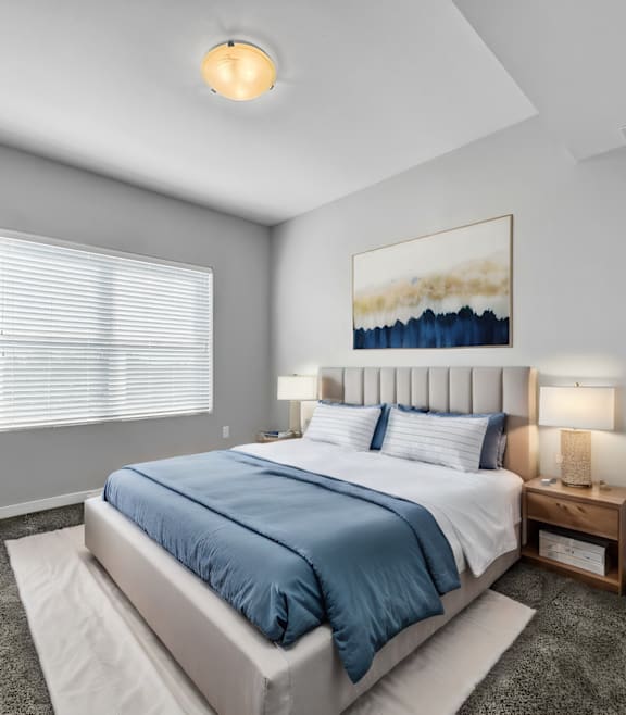 a bedroom with a bed and a window at Stonegate Crossing Apartments, IOWA, 50325
