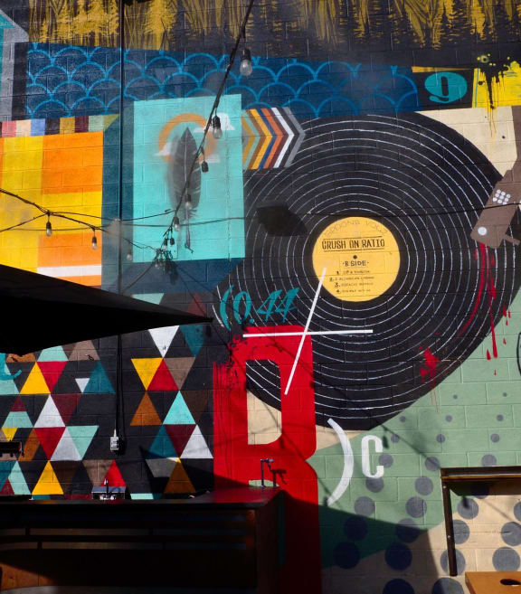 a wall mural with a record player on it