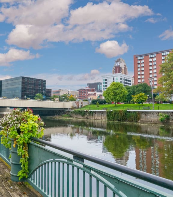 a walkway along the schuylkill river with the city of philadelphia in the