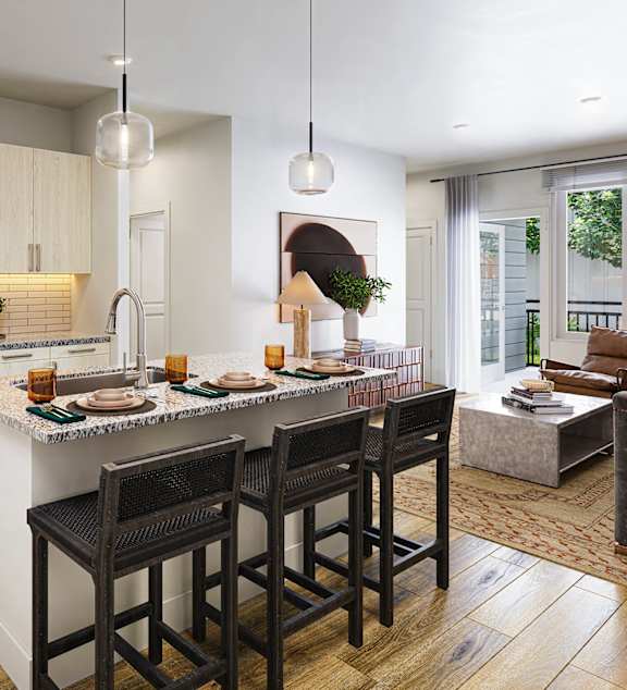 A kitchen with a bar area and a dining table.