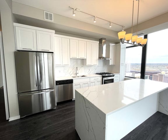 Nic on 5th Apartments- The Olivia floorplan with marble granite countertops, great lighting design and views of Downtown West Minneapolis
