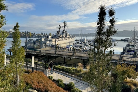 a dock with a large ship docked in a harbor