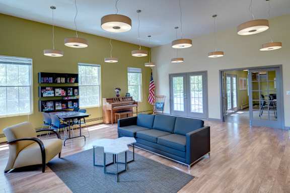 a room filled with furniture and a large window