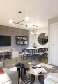 a bedroom with a bed and desk in a 555 waverly unit