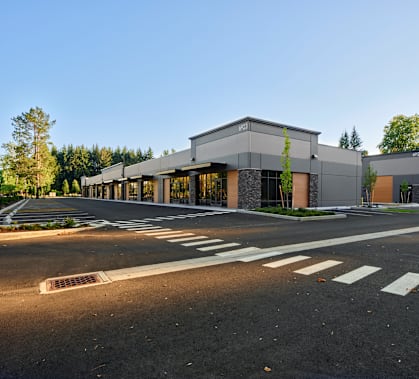 a large building with a street in front of it