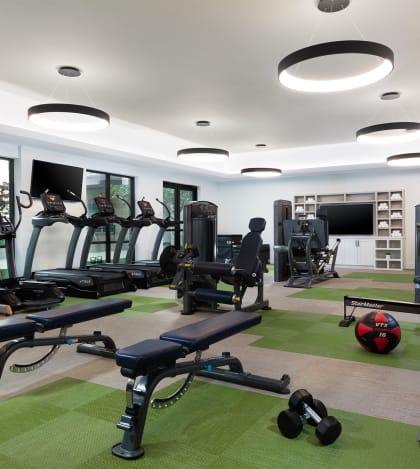 a room filled with lots of different types of exercise equipment