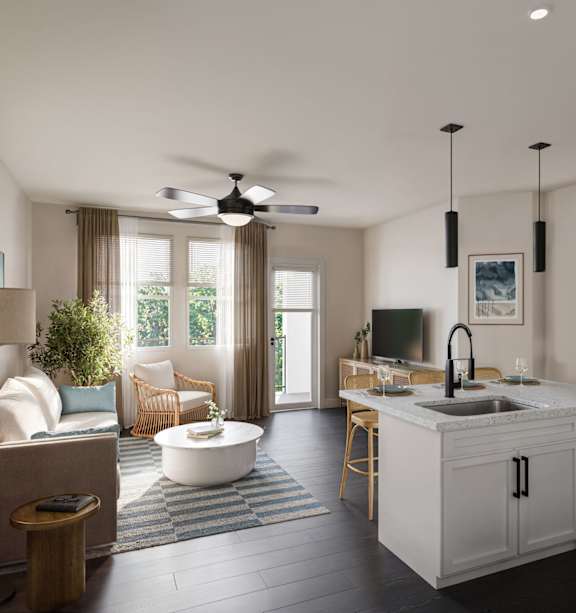 a kitchen with a long counter and white chairs