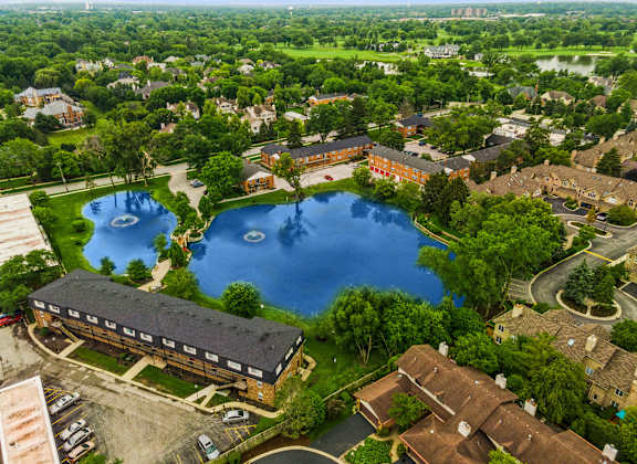 a birdseye view of a large pond in the middle of a city at The Hinsdale, Illinois, 60521