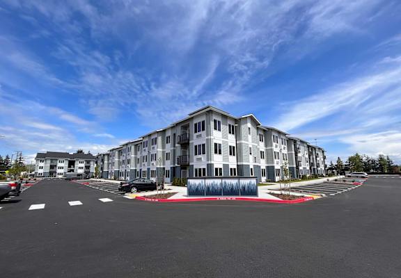a building with a parking lot in front of it