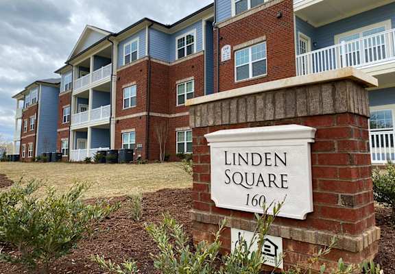 an apartment building with a sign that reads square 101