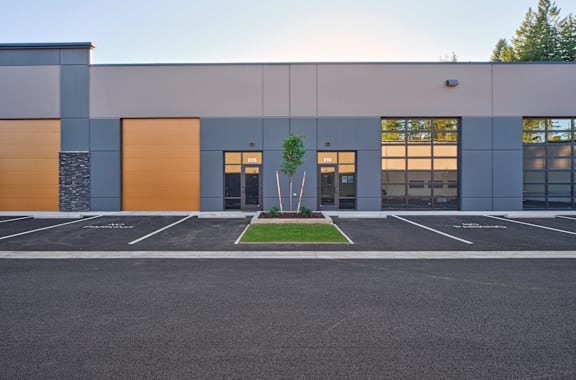 the exterior of a building with a parking lot