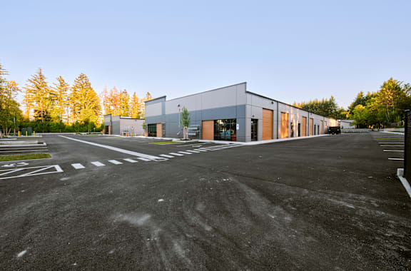 a large building with a parking lot in front of it