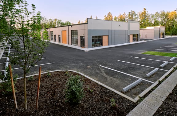 an empty parking lot in front of a building