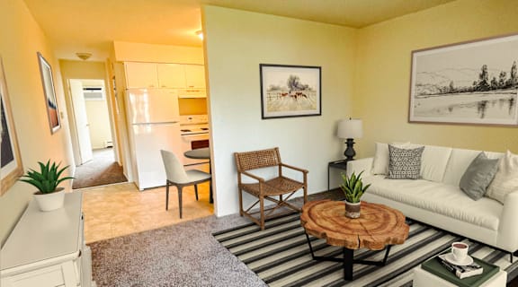 a living room with a white couch and a coffee table